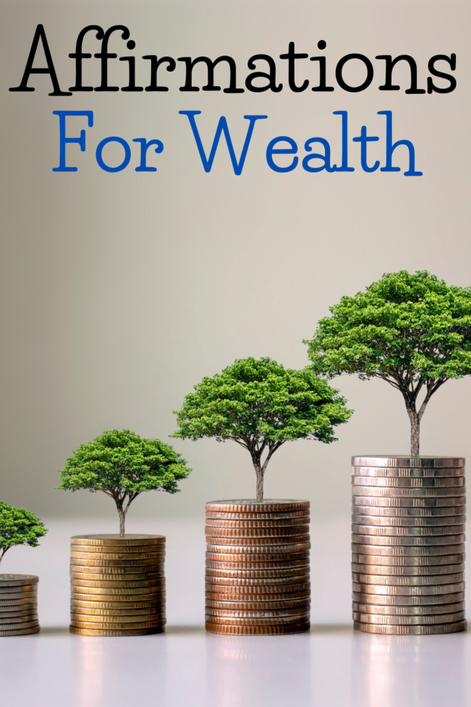 text reads "affirmations for wealth"with stacks of coins with trees on top.